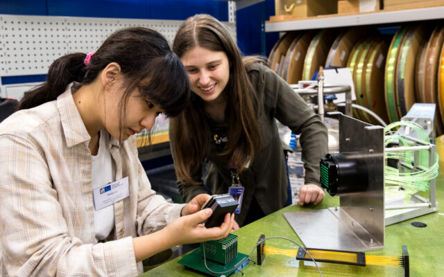 Student and mentor working on equiptment