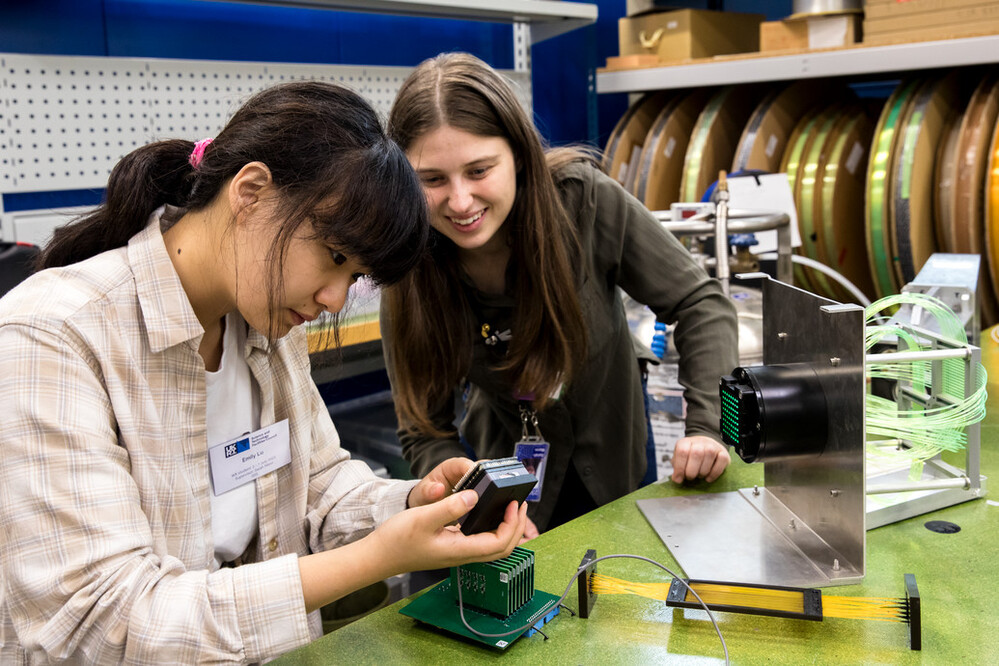 Student and mentor working on equiptment