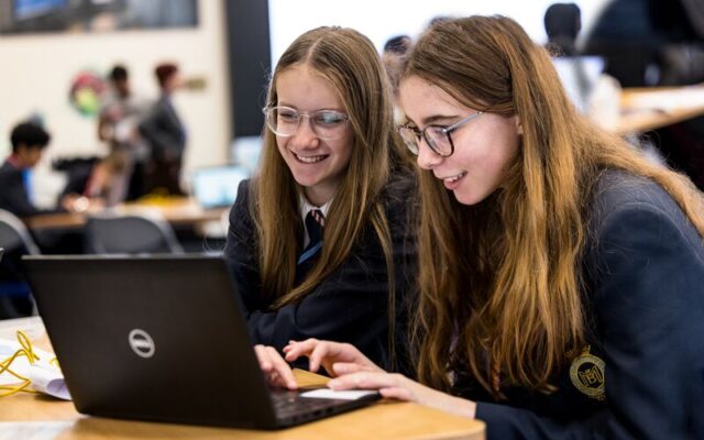 Two students using a laptop during Ada Lovelace Day