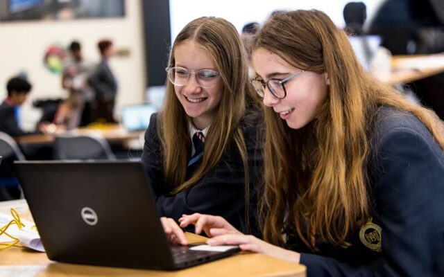 Two students work together on a laptop during an Ada Lovelace Day activity