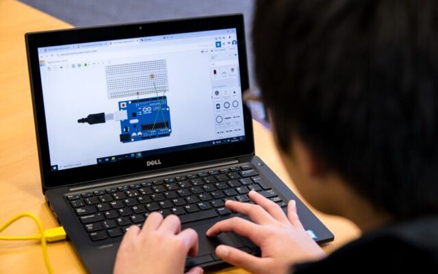 Student on laptop completing Ada Lovelace Day challenge