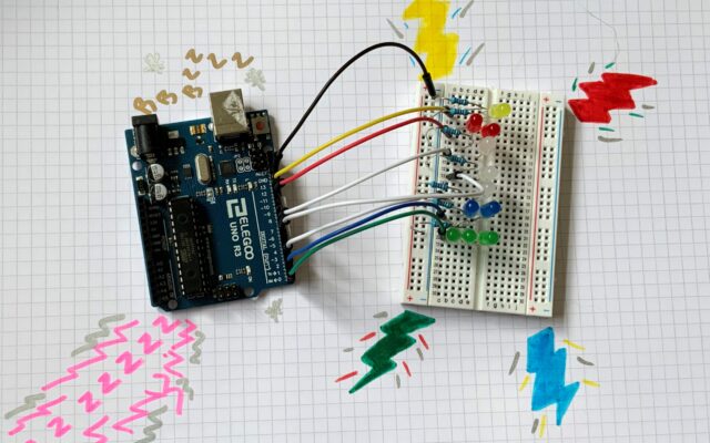 Arduino with wires to board with LED lights