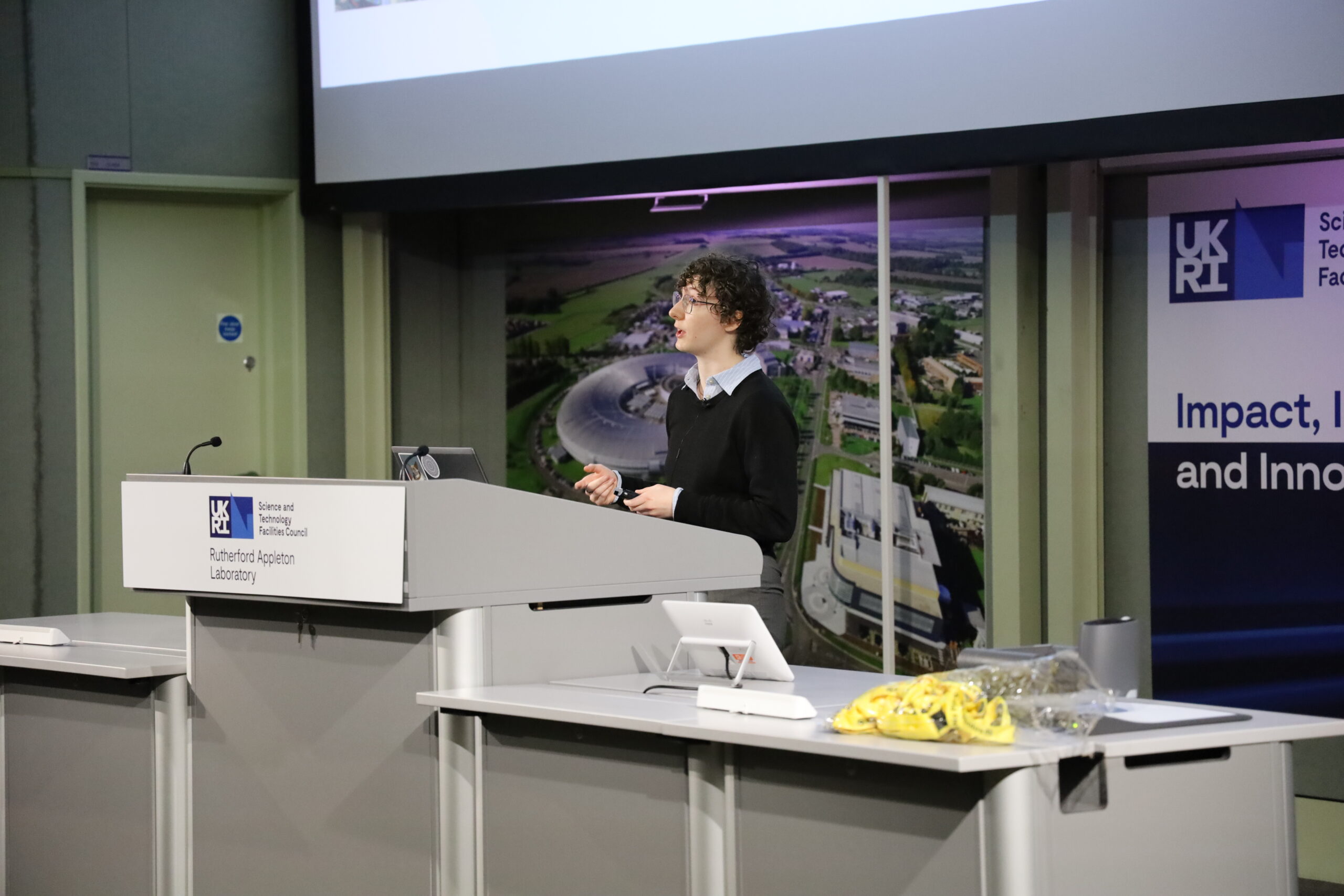 Staff member giving a talk in the lecture theatre
