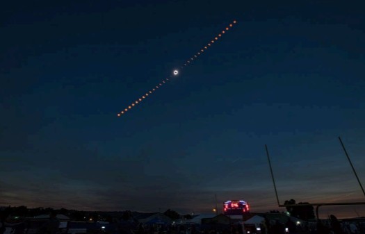 Total solar eclipse over Madras, Oregon, 2017. This is a composite image where each orange shape is the sun at a different moment in time, showing the progression from partial eclipse through totality and back again. Credit: NASA - science.nasa.gov/eclipses